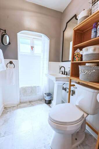 Refresh in our bathroom with a tub and shower combo—perfect for a relaxing soak or a quick shower after a day of exploring. Refresh in our bathroom with a tub and shower combo—perfect for a relaxing soak or a quick shower after a day of exploring.